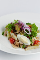 fresh greek salad with egg and vegetables