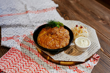 pie from the oven with cabbage and sauce