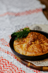 pie from the oven with cabbage and sauce
