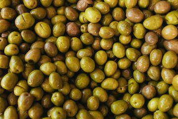 Green olives close up background.
