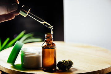 Glass bottle for marijuana oil, cosmetics with pipette. Cream and cosmetics with drugs, medicine...