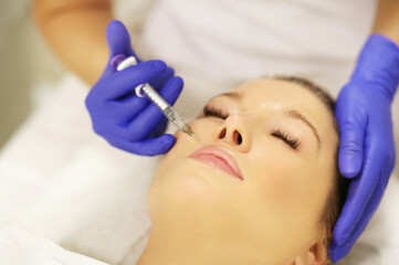 Naklejka premium Concept of rejuvenation.Volume lifting.Hyaluronic acid injections for specific areas.