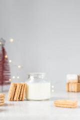 Filled Sandwich cookies with milk in a shot glass, Cream filled cookies, cookies on marble tray