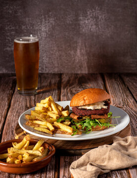 Food photography of vegan burger, hamburger,  fries, beer