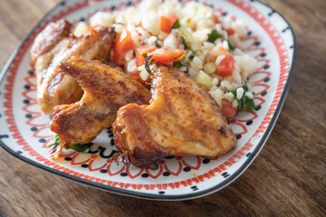 Grilled chicken wings with bulgur salad