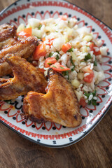 Grilled chicken wings with bulgur salad