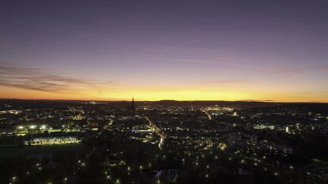 City center of Ulm from east while colorful dusk in autumn part 2 aerial time lapse