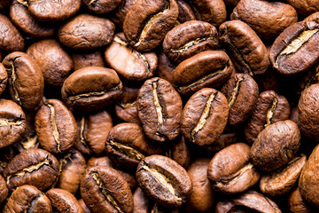 Roasted coffee beans top view, closeup image, space for text