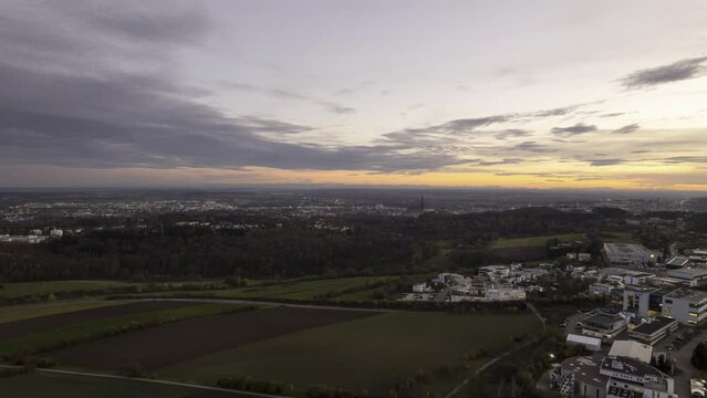 Cities of Ulm and Neu-Ulm with minster at evening in autumn with Alps aerial time lapse