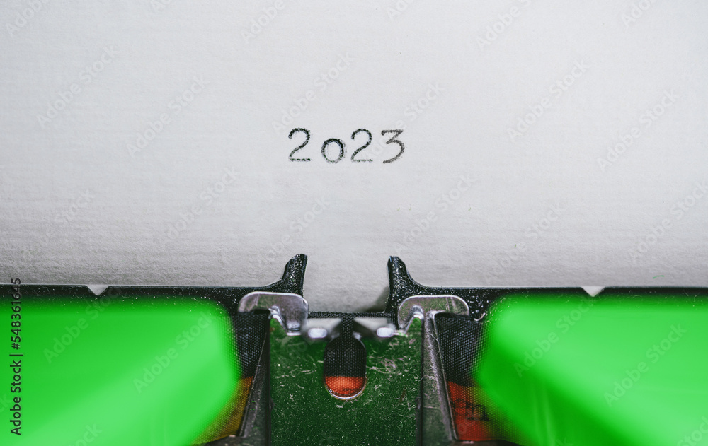Poster old typewriter with following text on paper - 2023 chapter one. new years concept