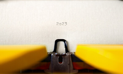 Old Typewriter with following text on paper - 2023 Chapter one. new years concept