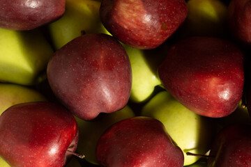Close up scattered red and yellow apples top view - red chief apples and golden apples
