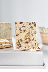 sliced raisin bread on tray, fruit bread baked in pullmans loaf