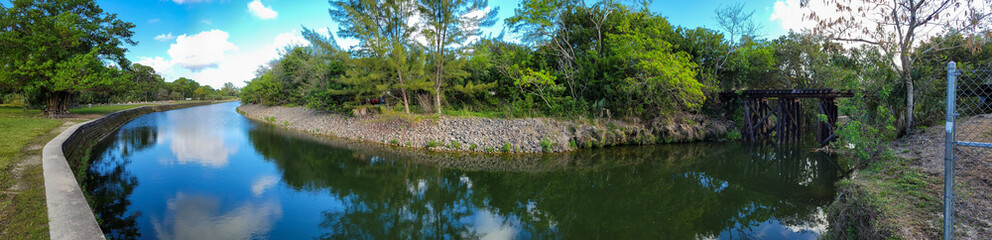 Panorama of an old railroad bridge at the park
