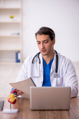 Young male doctor working in the clinic