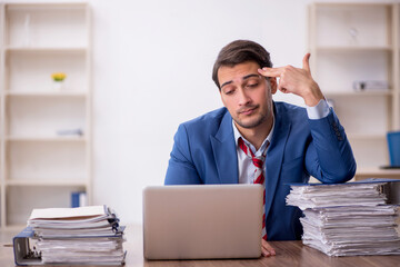 Young male employee working in the office