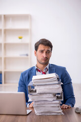 Young male employee working in the office