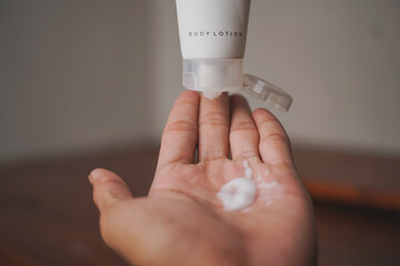 applying hand and body lotion cream 