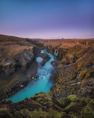 Fototapeta na wymiar Beautiful waterfall with turquoise water in Iceland