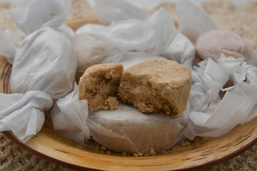 Polvorones wrapped in tissue paper, typical Christmas sweets in Spain