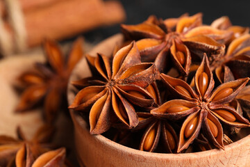 Aromatic anise stars in bowl, closeup view