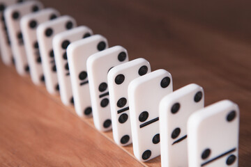 White dominoes in the dark close up