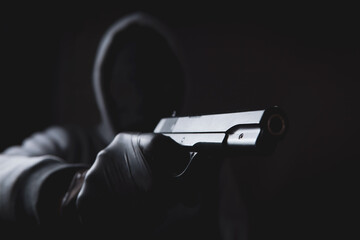 masked man holding a gun - Powered by Adobe