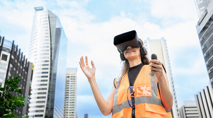 Futuristic female Architectural Engineer Wearing Augmented Reality Headset and Using Gestures to...