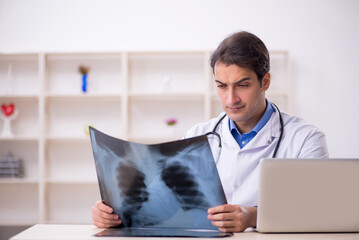 Young male doctor radiologist working at the hospital