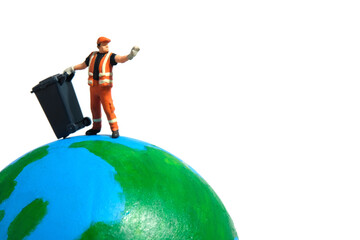 Cleaning worker with trash bin standing above earth globe. Global waste concept. Miniature people...
