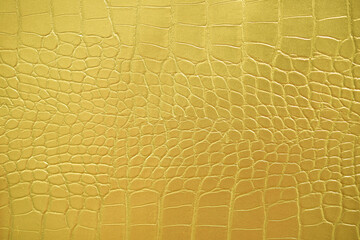 Crocodile bone skin texture background. Golden Leather background and texture.