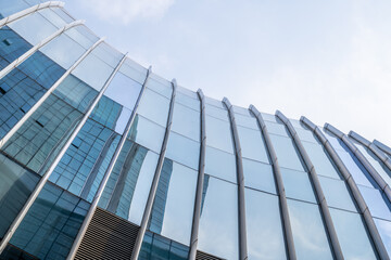 The glass curtain wall of the city CBD office building shot from above