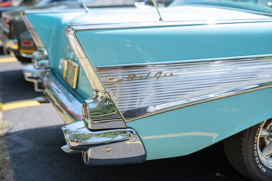 NISSWA, MN – 30 JUL 2022: Rear tailfin of a restored classic 1957 Chevrolet Bel Air automobile, in closeup view. An iconic feature of the Chevy 57 car.