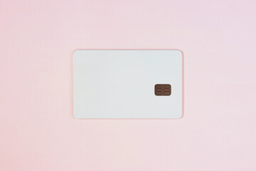 Photo mock-up of white credit card on pink background