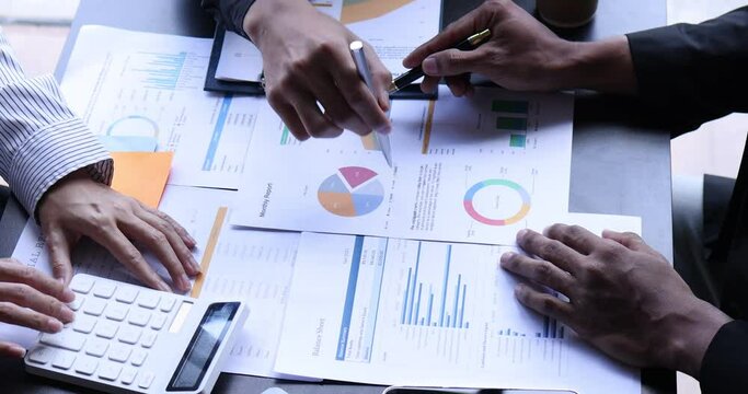 4k video footage of a group of Business people discuss investment project working on Statistical analysis and accounting of annual financial data of enterprises employee.