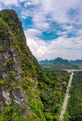 Fototapeta na wymiar Aerial view of Krabi roads between limestone mountains, in Krabi province, Thailand
