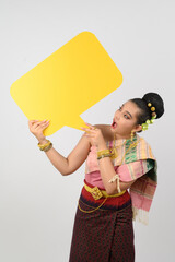 Young beautiful woman in Thai lanna costume with blank speech bubble sign