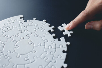 piece of Red green and gold jigsaw puzzle On the old wood And green background. teamwork concept. symbol of association and connection. business strategy.