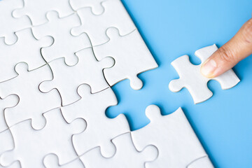 Jigsaw puzzle with missing piece. Completing final task, missing jigsaw puzzle pieces and business...