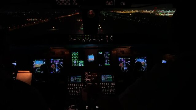 Unique jet cockpit view during a real landing at Athens airport at night.