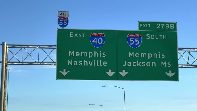 Direction signs on the highway to Memphis and Nashville - POV driving by - travel photography