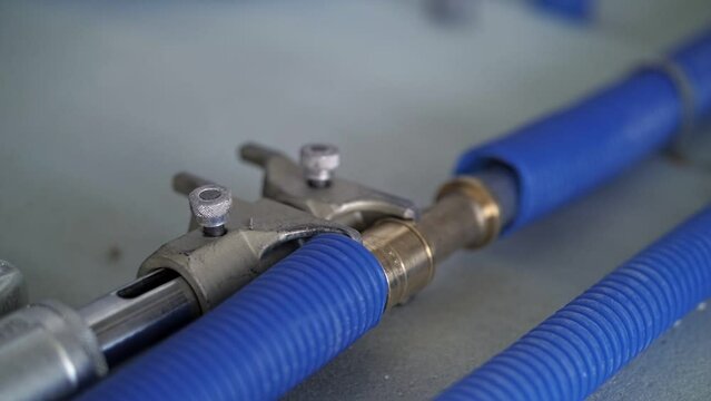 workers connect the heating pipes