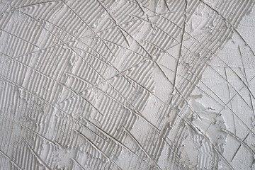textured of scratched plaster wall, surface scratches for helps second coat of plaster to adhere scratch coat create a bond between the two layers