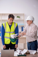 Two male architects working on the project