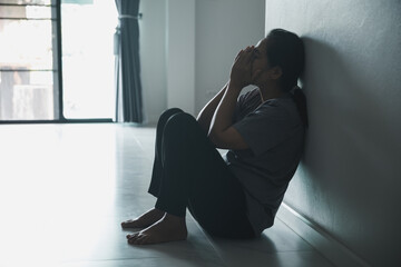 Schizophrenia with lonely and sad in mental health depression concept. Depressed woman sitting...