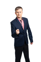 a young man in a business suit shows a fig, with a gesture demonstrates that you will not get anything. isolated