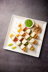 Fototapeta na wymiar Malai Paneer Tikka Kabab is an Indian asian food made using cottage cheese grilled with cream