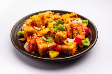 chilli paneer dry is made using cottage cheese, Indo chinese food