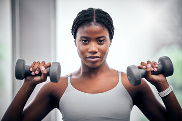 Face portrait, dumbbells and black woman training in gym for muscle, strength and power. Sports, energy and young female bodybuilder weight lifting in fitness center for wellness, workout or exercise - obrazy, fototapety, plakaty