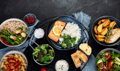 Table of various healthy food dishes. Healthy food assortment. Dieting concept.